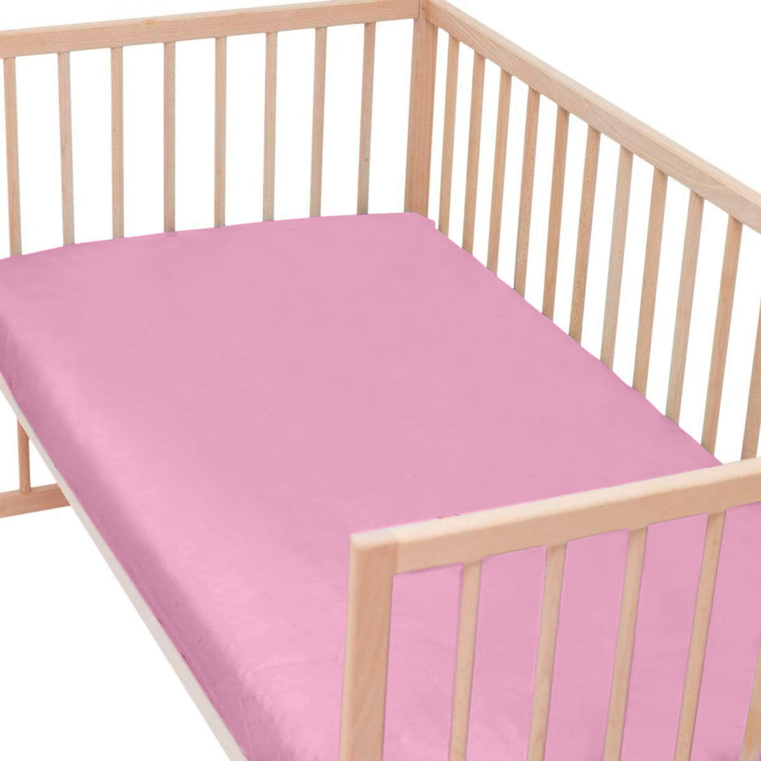 Kinderhoeslaken jersey roze op ledikant - Beterkatoen