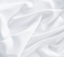 Detail van wit katoenen laken - glad geweven stof, zacht en ademend - Beterkatoen